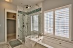 Master Ensuite Bathroom with Walk-In Rain Shower and Tub